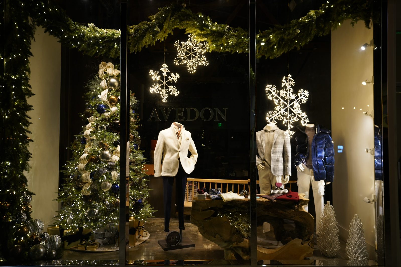 A boutique window on Rodeo Drive dressed in snowflakes and greenery